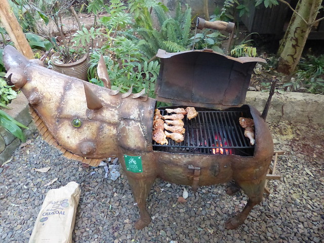 The ultimate backyard BBQ from Cookswell Energy Saving Jikos ~ a one of a kind handmade grill/smoker with a ceramic firebox for optimum efficiency and durability and handblown Kitengela glass eyes from recycled wine bottles.