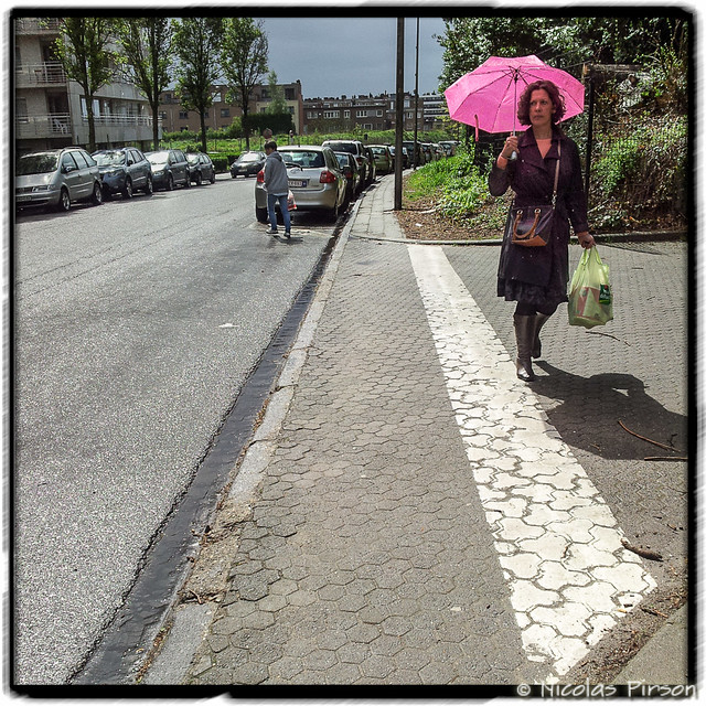 Cute woman with a pink umbrella