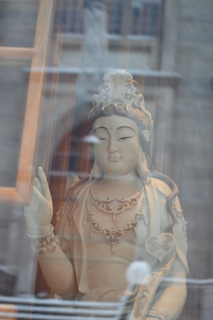 Reflected blessings of Kuan Yin and Notre Dame Cathedral