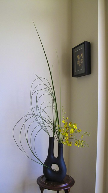 Ikebana with yellow orchids