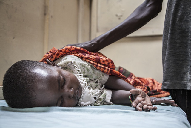 A mother and her sick child wait treatment in a hospital in Kakuma Refugee Camp, nortern Kenya.