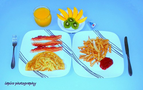 Breakfast at home. Eggs Bacon fries & fresh fruits | by denoom