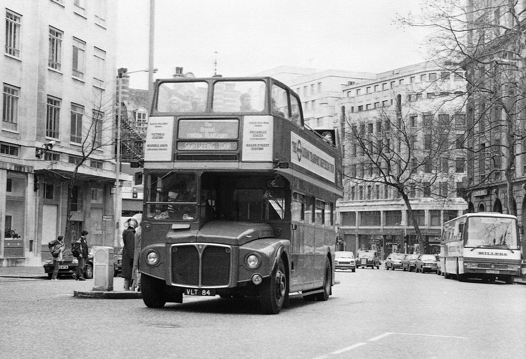 RM84 (VLT 84) open top sightseeing Routemaster in action at Aldwych