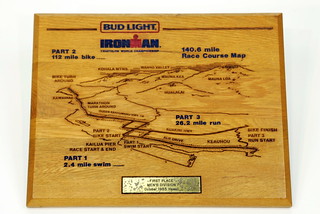 Sun, 11/23/2014 - 14:36 - I only have two, maybe three trophies left from the twenty years that I competed in Kona. This one is the coolest. It’s a laser-engraved map of the course in hardwood. Of course, there was no prize money for the event in 1985.