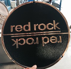 Powder coated floor plate for Red Rock Hotel and. casino. Coated black with clear.