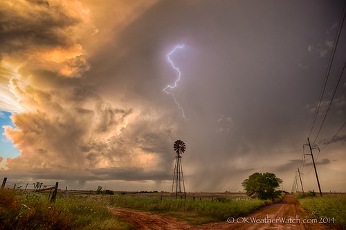 Sunset glow on developing storms by OKWeatherWatch, sunset storm windmill lightning