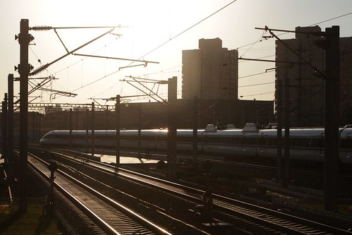 CRH train heads off into the sunset at Beijing South railway station