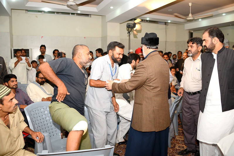 Dr Qadri with injured PAT Workers
