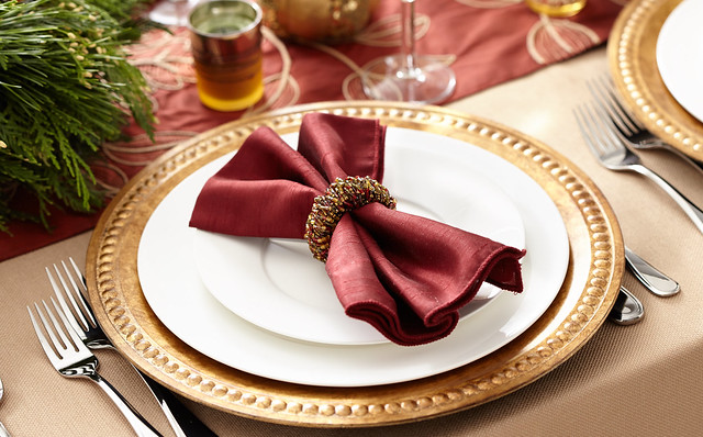Thanksgiving table setting with napkin, napkin ring silverware and plates