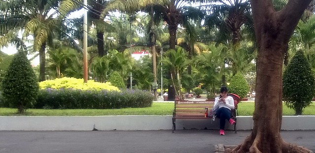 Girl in Pink Shoes Sitting in the Park