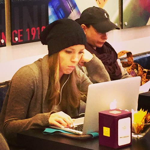 Girl with laptop at a coffee shop