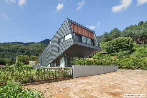 Unusual Zinc-Cladded Leaning Residence Disrupts Hillside Landscape | by interiordecors3