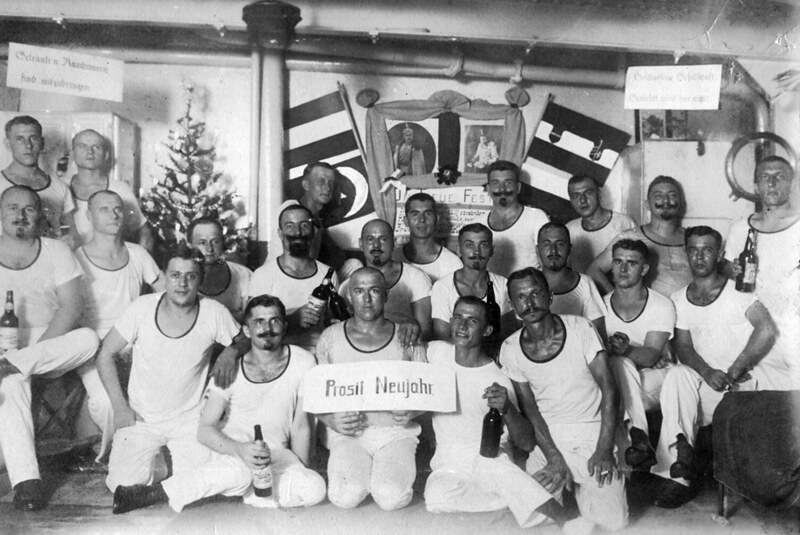 Crew members of the SMS Cormoran gather for a group photo during their New Years party, 1915. Photo from SMS Cormoran album at Manuscripts Collection RFT MARC, University of Guam.