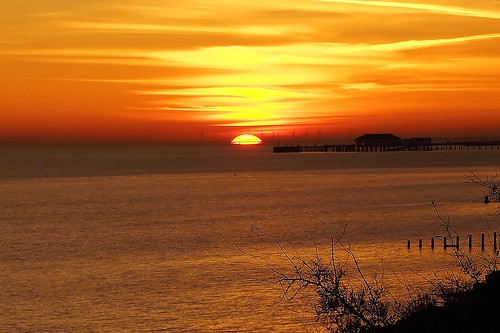 sunset sea water pier seaside redsky clactononsea