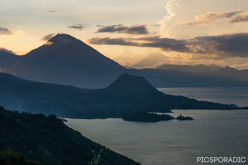Atitlan Sunset by PICSPORADIC, Sunset over Lake Atitlan Guatemala. Cerro Te Orro cone is visable (forground) with Volcan San Pedro