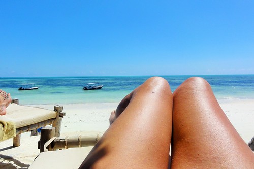 woman beach legs sunbathing