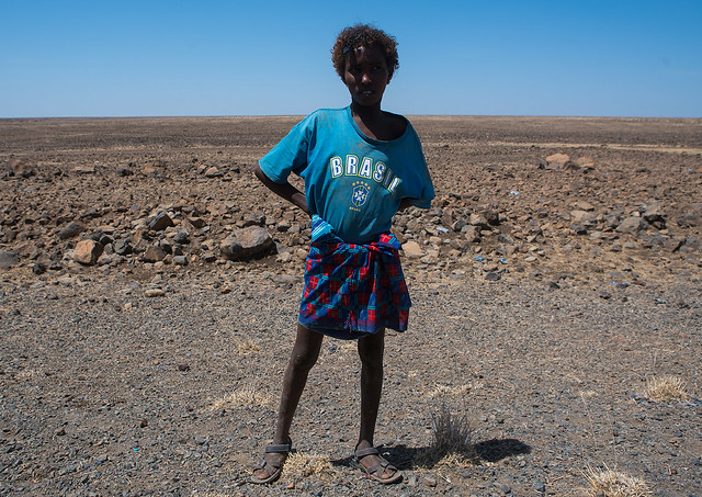 Somali boy with a brazil football shirt in the desert, Afar region, Yangudi rassa national park, Ethiopia