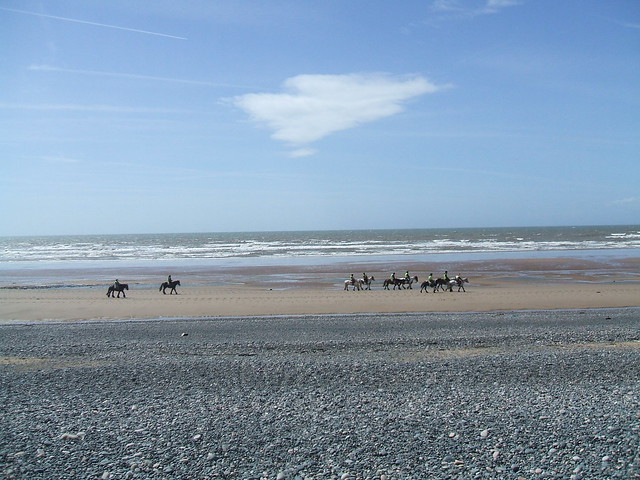 Pony trekking on Silecroft sands.