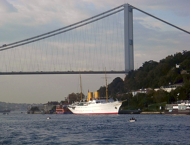 Motor yacht 'Savarona' moored under the Bosphorus Bridge.