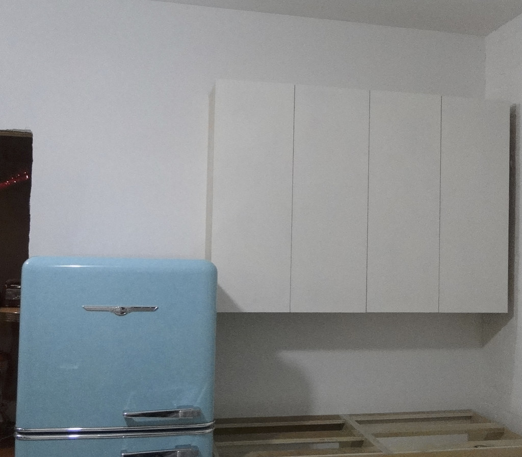Primed Cabs Installed | Kitchen Cabinets being Fitted before… | Flickr