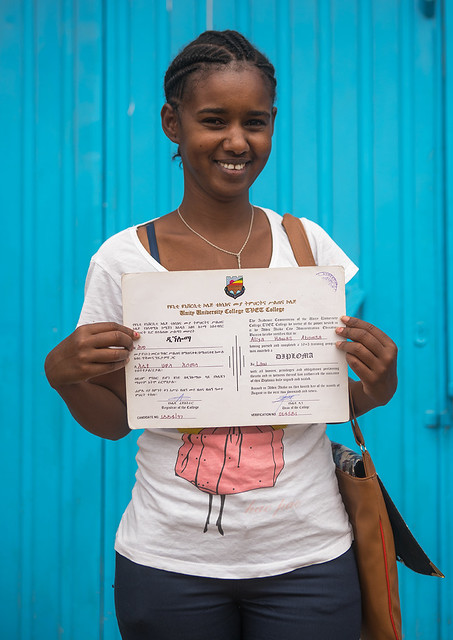 A karrayyu tribe girl called aliya who was the first girl educated in her tribe showing her diploma, Oromia, Metehara, Ethiopia