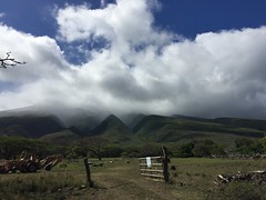 Clouds, hills, ranch
