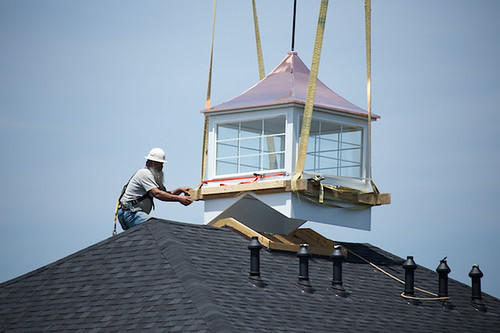 Construction Crews Install the Cupola Atop Caruthers House