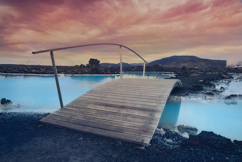 travel bridge vacation sky mountains ice nature landscape fire iceland europe day cloudy redsky hotspring spa bluelagoon