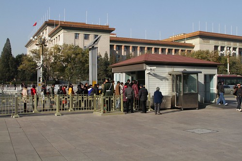 Visitors wait in the security line before entering Tiananmen Square