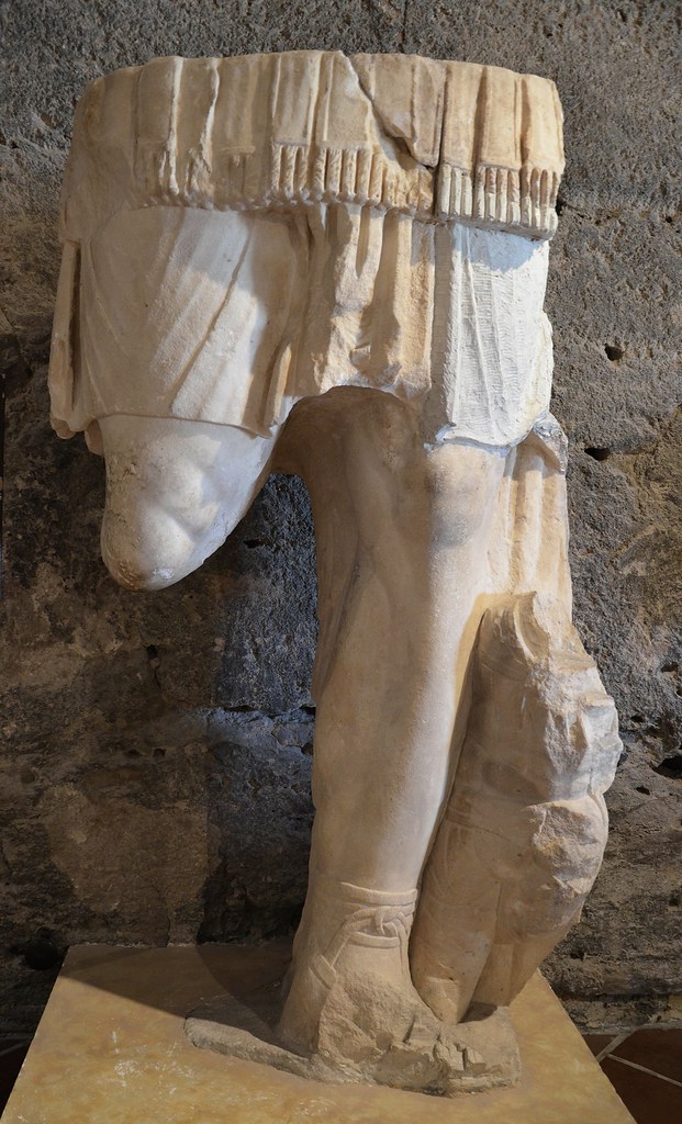 Fragment of a colossal statue of Hadrian wearing a cuirass with a barbarian kneeling a this feet, from the temple area, Hierapolis Archaeology Museum, Turkey