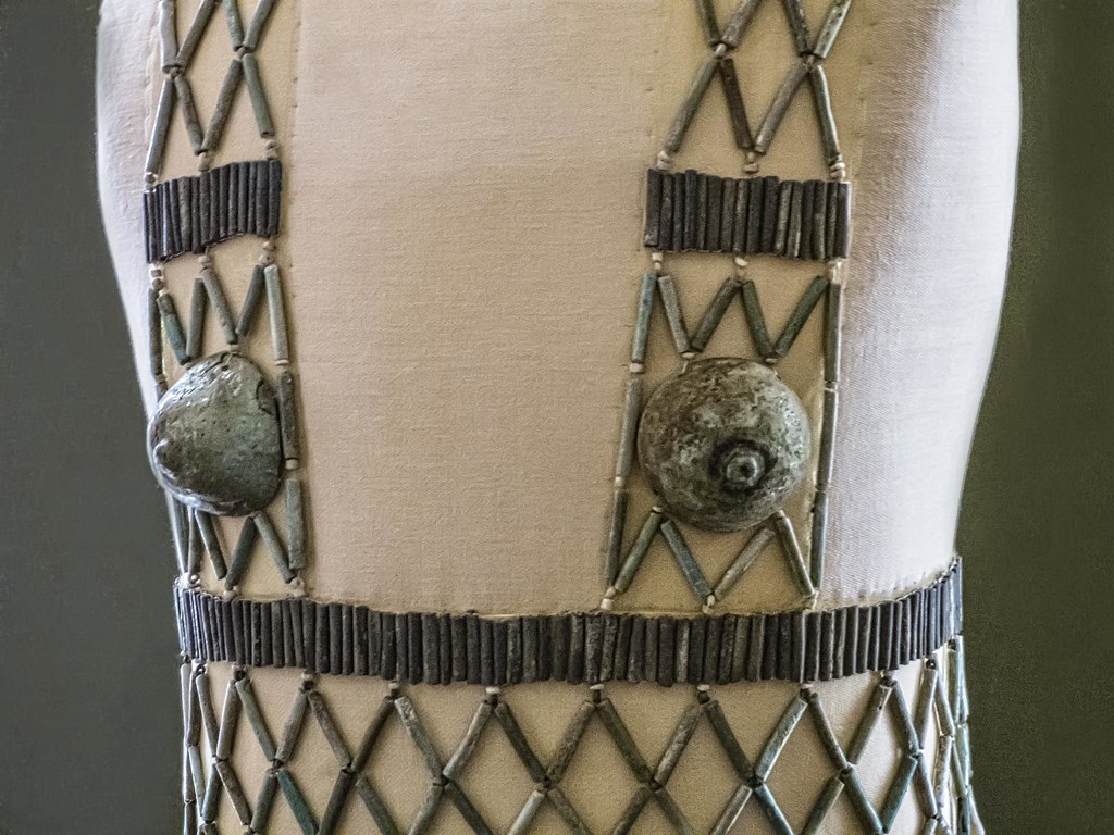 Closeup of Qao bead net dress Faience, blue and black cylinder beads, 2 breast caps and 2 strings of Mitra beads. 5th Dynasty Old Kingdom. From burial 978 at Qau (Tjebu), Egypt.