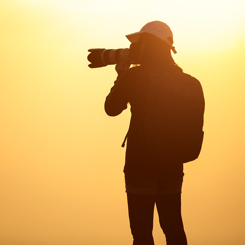 Silhouette female photographer by Patrick Foto ;), Silhouette female photographer taking a picture with the sun behindcamera travel light sunset summer