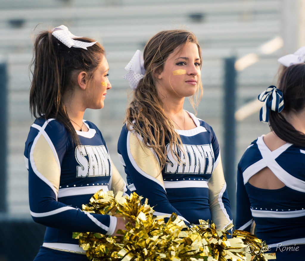 High school football: cheerleaders on sidelines.