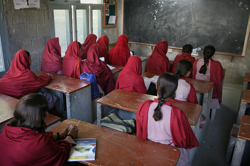 Girls from a school supported by Hashoo Foundation sit in their classroom.