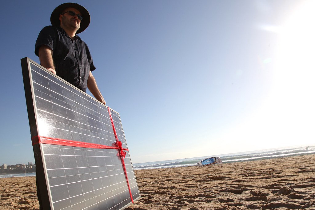 Solar panel gift on Manly beach as Common Grace ask PM Tony Abbott to #acceptthegift of solar for Kirribilli House
