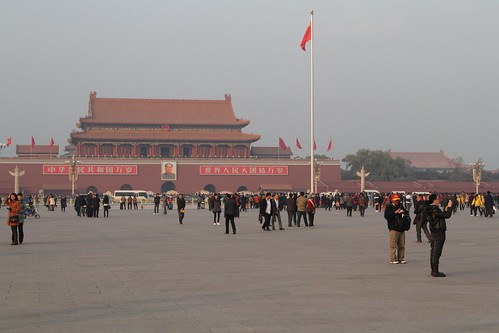 Haze fills the air at Tiananmen Square as the sun starts to set