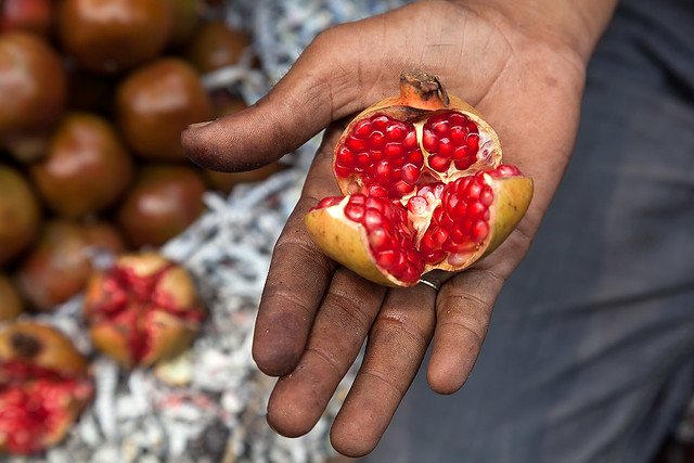 Selling Pomegranates at Mechua market in Kolkata, India.