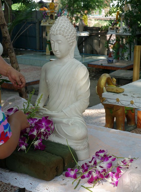 decorating a white buddha image