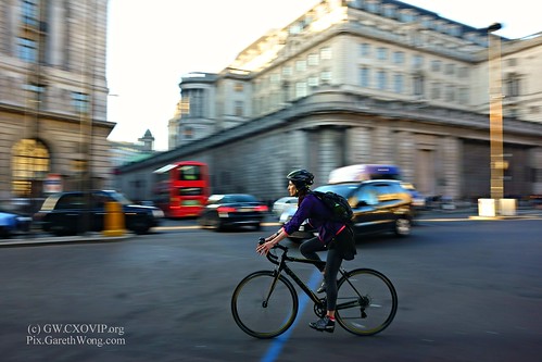 Focused or already daydreaming lady biker leaving work at Bank junction City of London from RAW _DSC7314 by garethwong