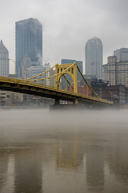 Fog sits under the Andy Warhol Bridge