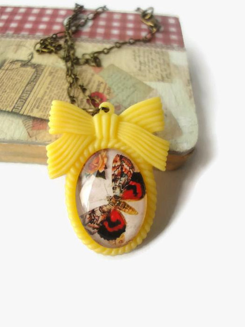 Brown red butterfly oval glass pendant necklace. resin yellow ribbon frame. insect jewelry. antique print