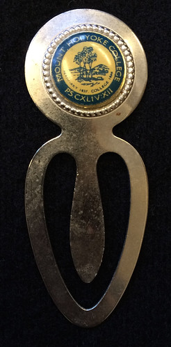 Pin and bookmark decorated with the MHC seal