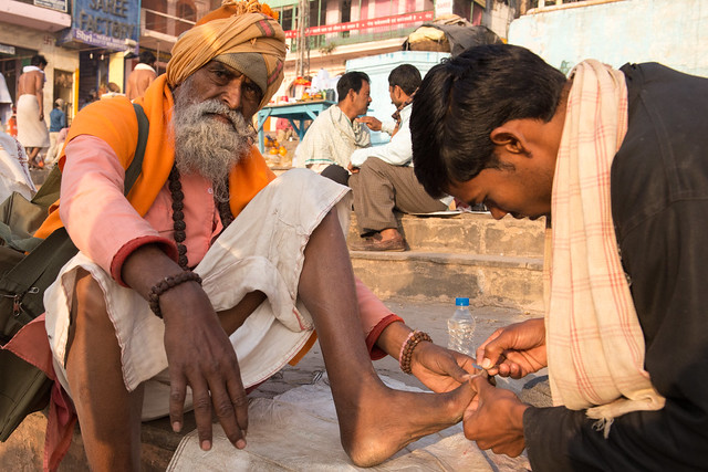 toenail cutting on the ghats in Varanasi.