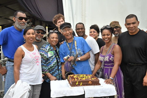 Family and friends surprise Kidd Jordan with a birthday cake. Photo by Marc PoKempner.