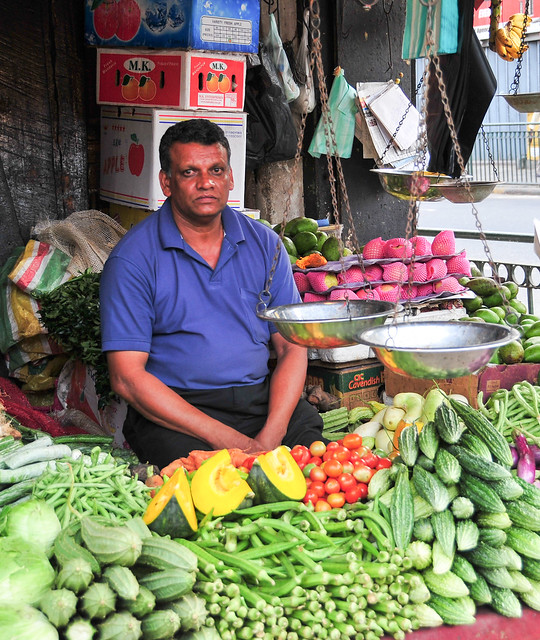 Portrait of elderly market vendor
