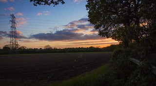 The sun setting over the countryside