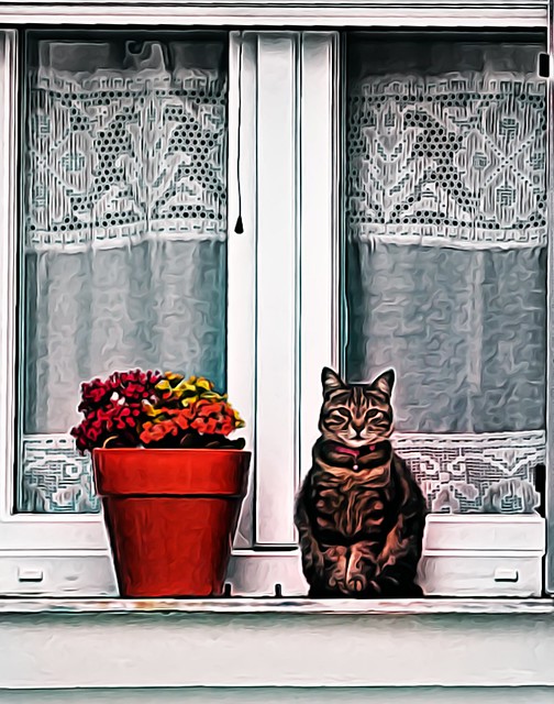 Cat posing as a flower pot, uncanny