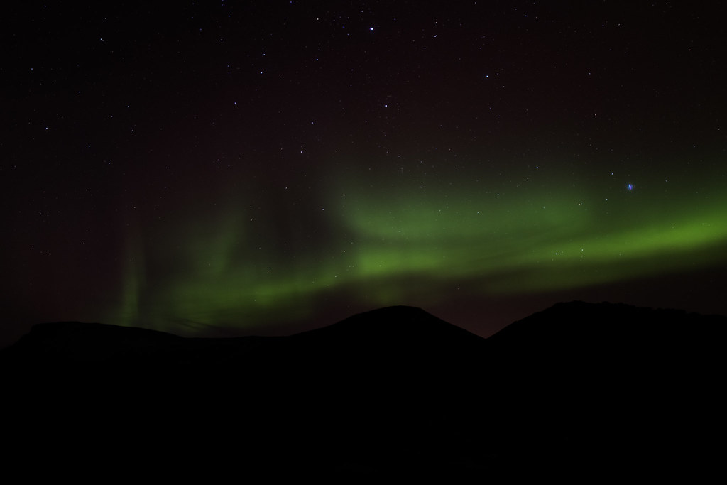 Aurora over Icelandic hills