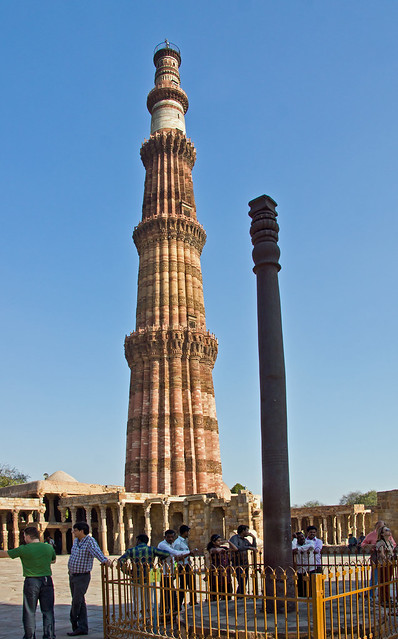 qutb minar + iron pillar from courtyard of the Quwwat-ul-Islam mosque - delhi, india