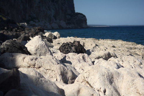 black rock beach stone calagonone italy sardinia nikond7100 85mmf18 evening coast mountains sea water landscape light shadow white